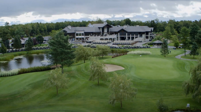 Golf club with parking lot full of golf carts