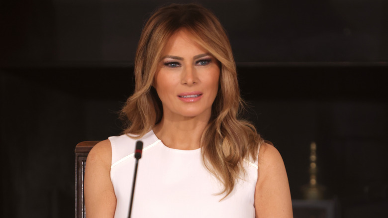 Melania Trump speaking at microphone