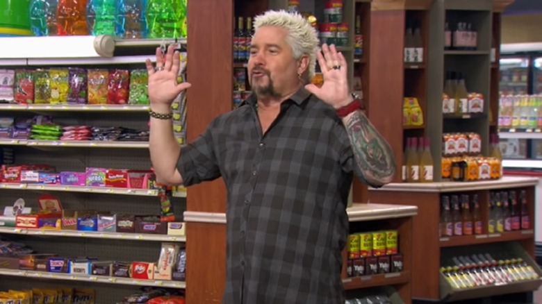 Guy Fieri with his hands up