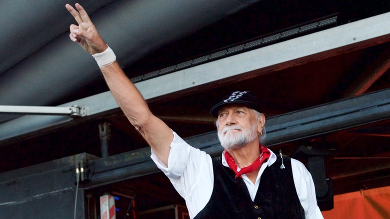 Mick Fleetwood throws up a peace sign