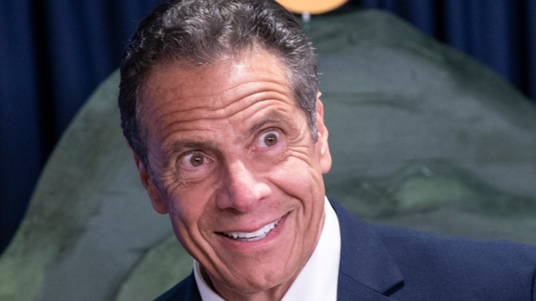 Andrew Cuomo wearing a bizarre grin