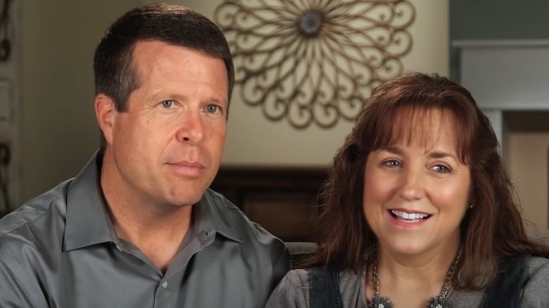 Michelle Duggar smiling beside Jim Bob Duggar