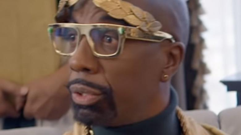 J.B. Smoove as Caesar in gold glasses