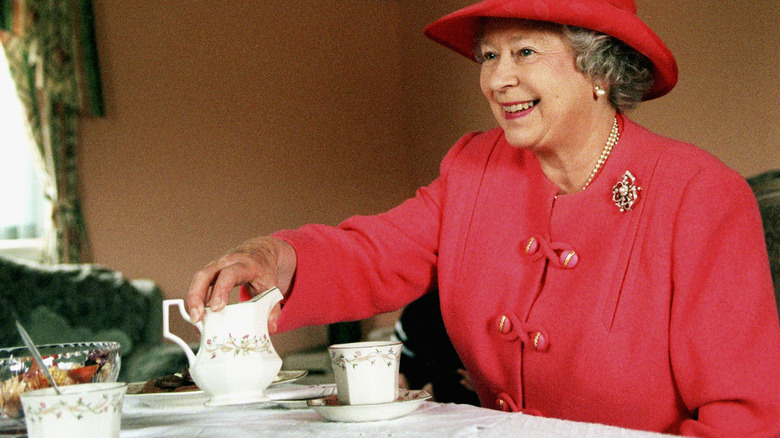 Queen Elizabeth drinking tea