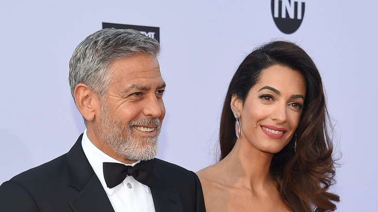 George and Amal Clooney smiling 