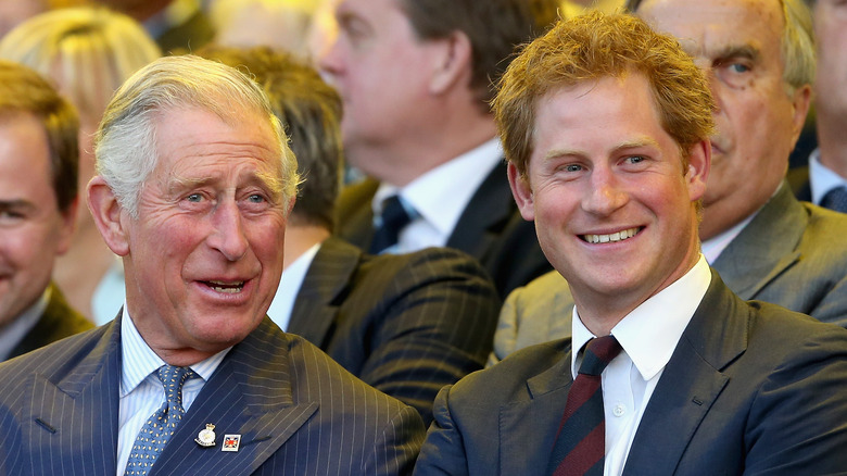 Prince Charles and Prince Harry smiling