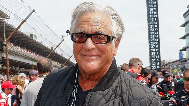 Barry Weiss smiles at a racing event