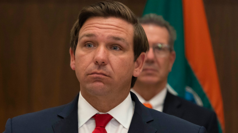 Ron DeSantis at a microphone