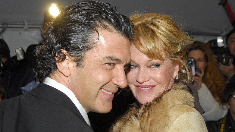 Antonio Banderas and Melanie Griffith smiling on the red carpet