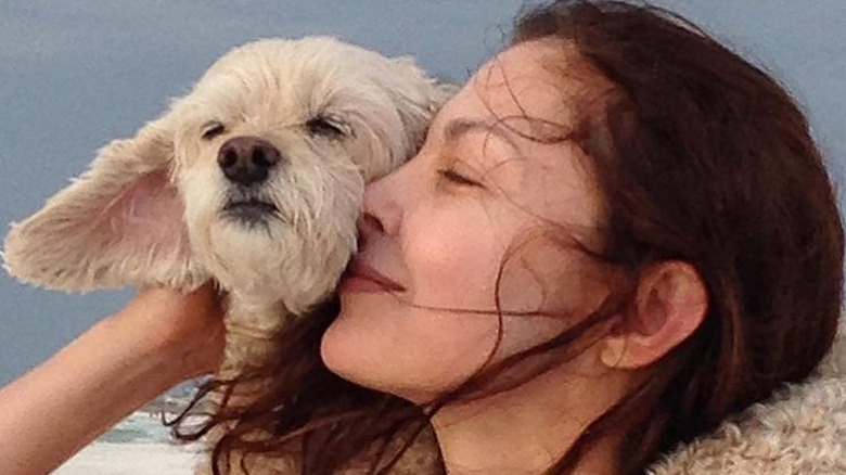 Ashley Judd smiling with dog