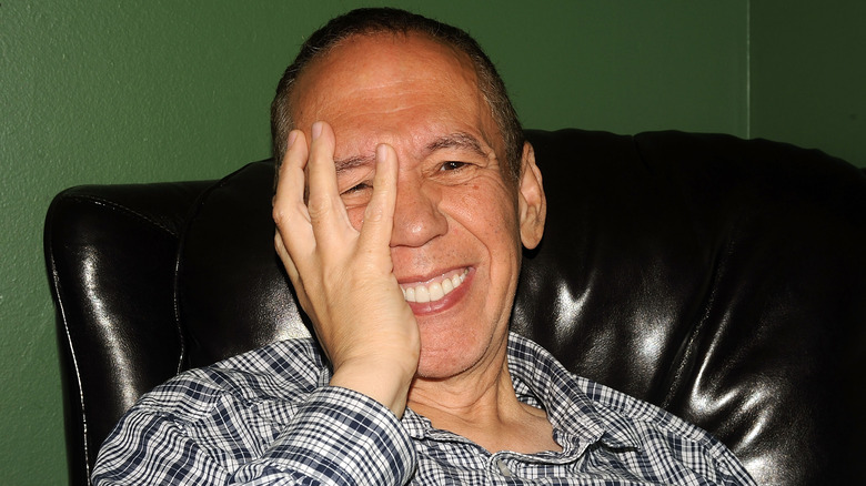 Gilbert Goffried laughing hand on face