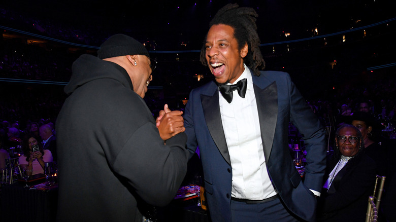 LL Cool J and Jay-Z sharing a handshake