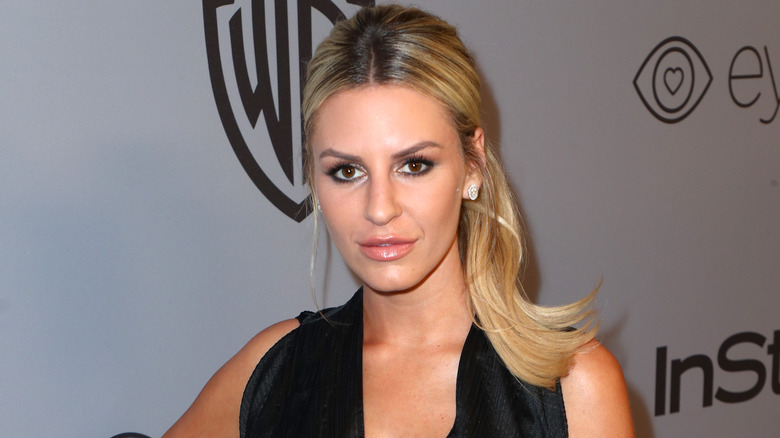 Morgan Stewart, looking annoyed, 2018 red carpet, black dress, hair up