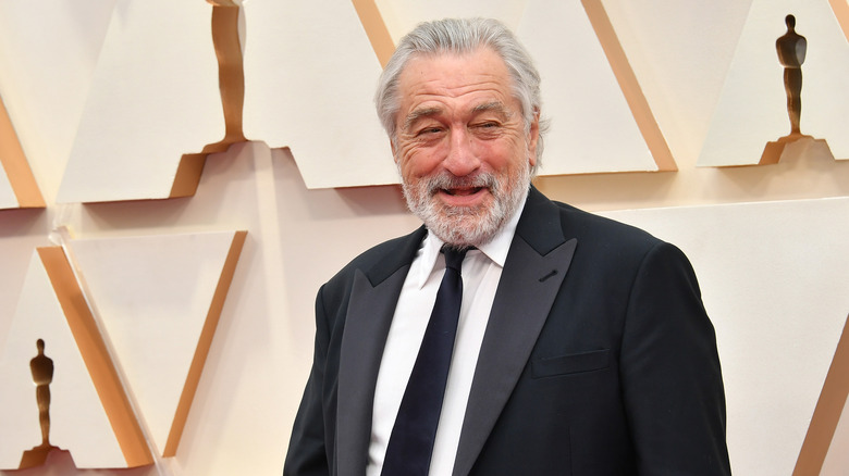 Robert De Niro smiling on the red carpet