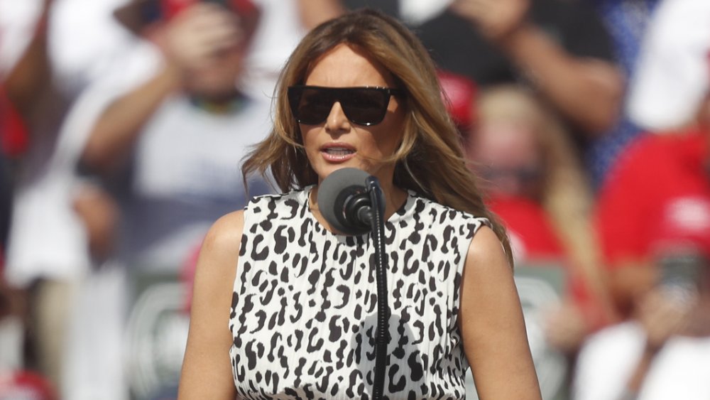  Melania Trump wearing sunglasses, speaking at a rally 