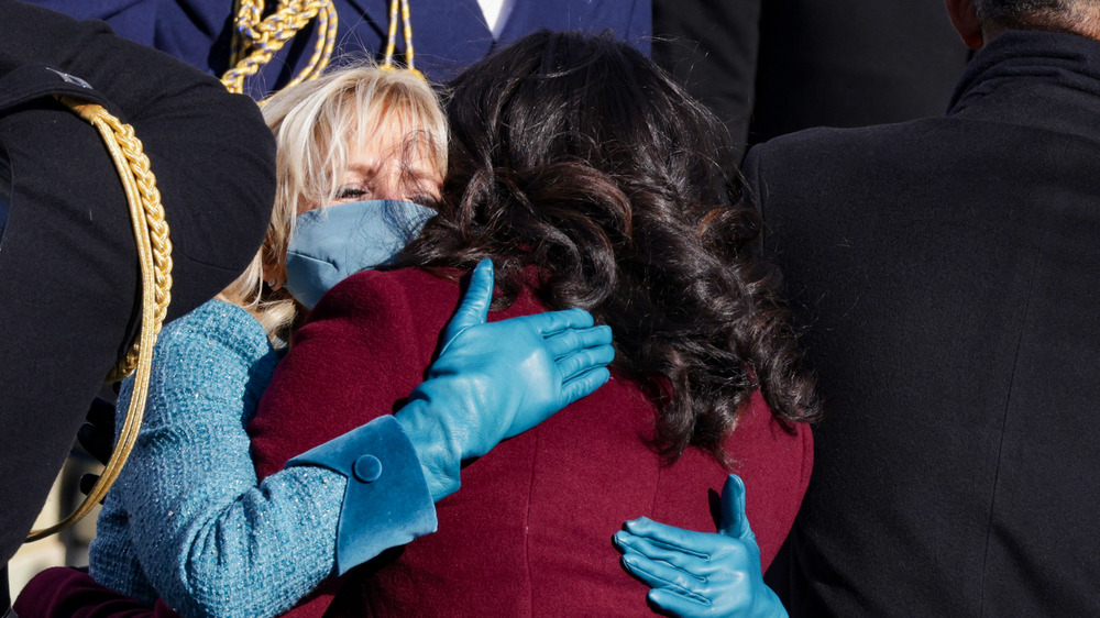 Jill Biden and Michelle Obama share a hug