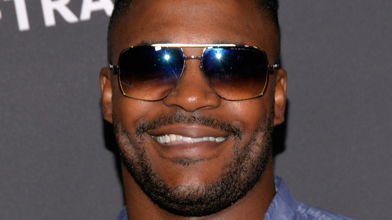 Duane Henry smiles on the red carpet