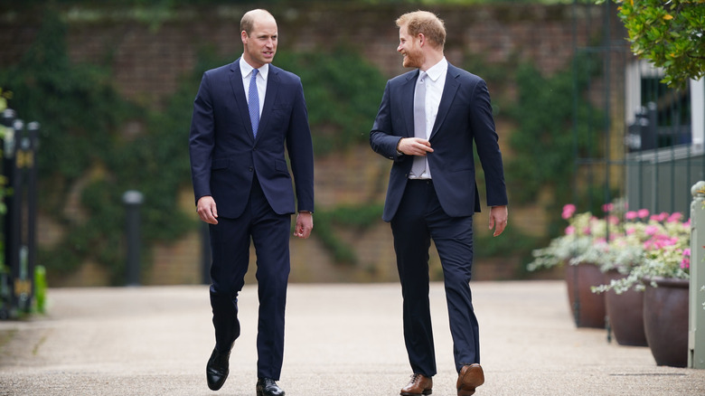 Prince William and Prince Harry walking and laughing