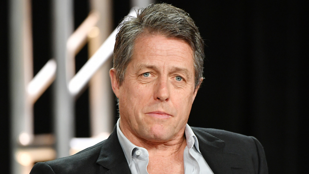 Hugh Grant with a serious expression