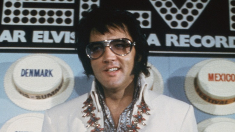 Elvis Presley white jacket sunglasses