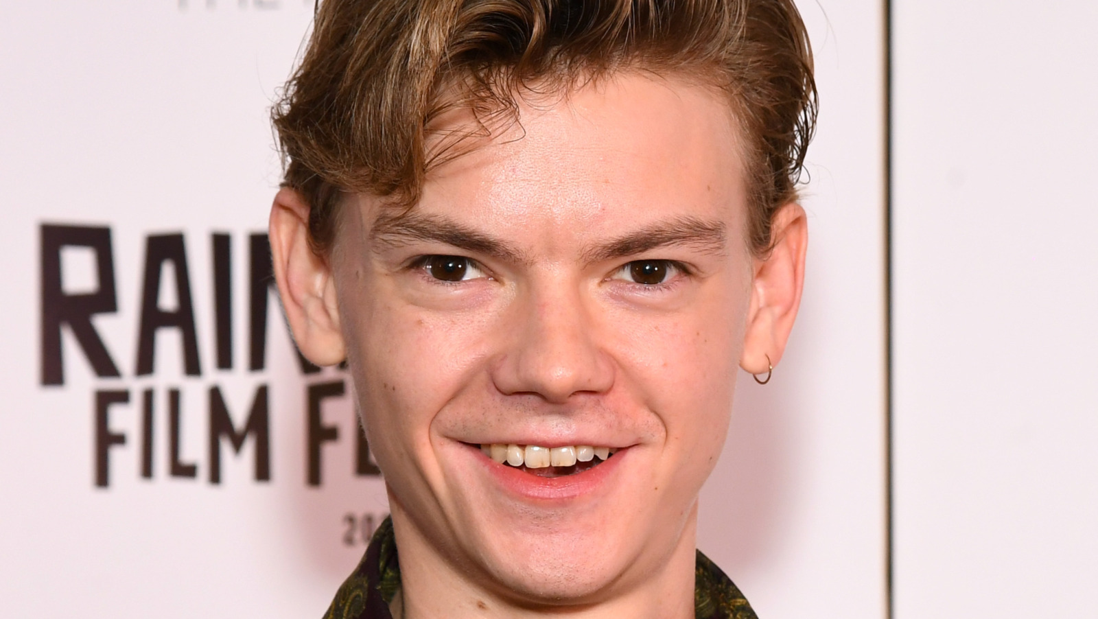Thomas BrodieSangster Has A Surprising Connection To Hugh Grant