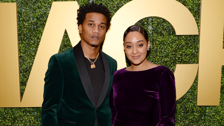 Cory Hardrict and Tia Mowry pose at event