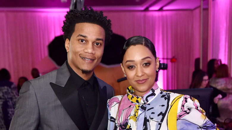 Cory Hardrict and Tia Mowry pose at an event in 2020