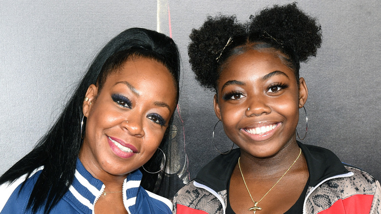 Tichina Arnold and Alijah Kai pose on the red carpet