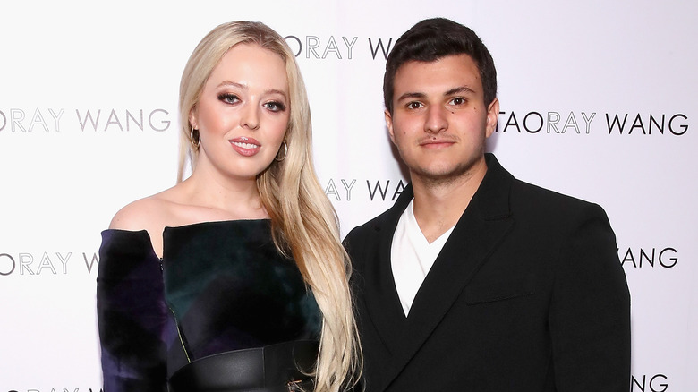 Tiffany Trump and Michael Boulos pose at New York Fashion Week