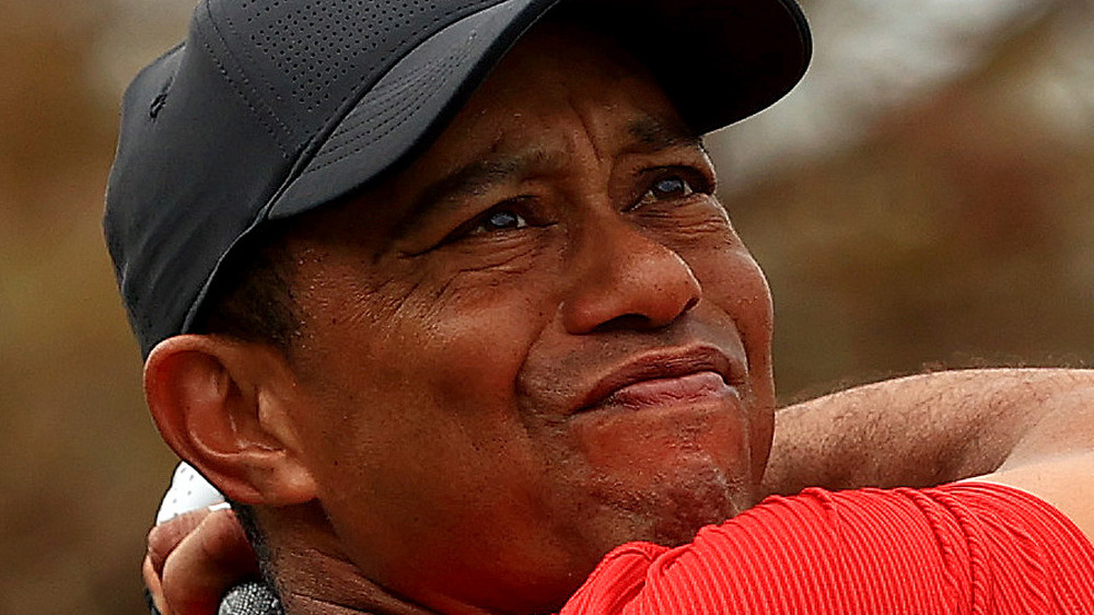 Tiger Woods makes a shot on the golf course