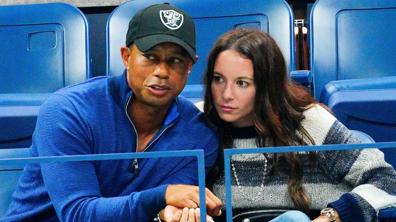 Tiger Woods and Erica Herman huddling