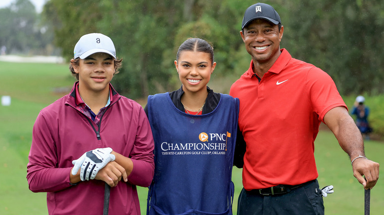 Tiger Woods posing with Charlie and Sam Woods at the 2023 PNC Championship