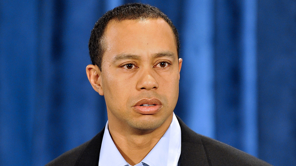 Tiger Woods, public apology in 2010, wearing suit, looking sad, teary 