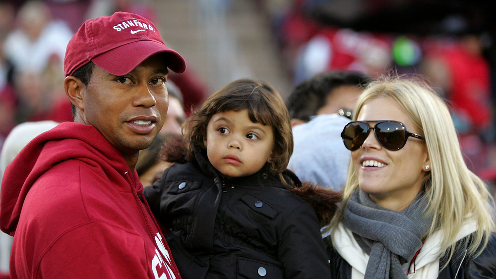Tiger Woods and Elin Nordegren with their daughter at an event