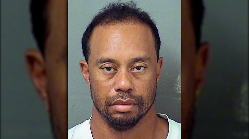 Tiger Woods posing for his 2017 mugshot