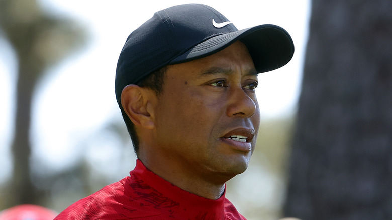 Tiger Woods in a navy blue hat 