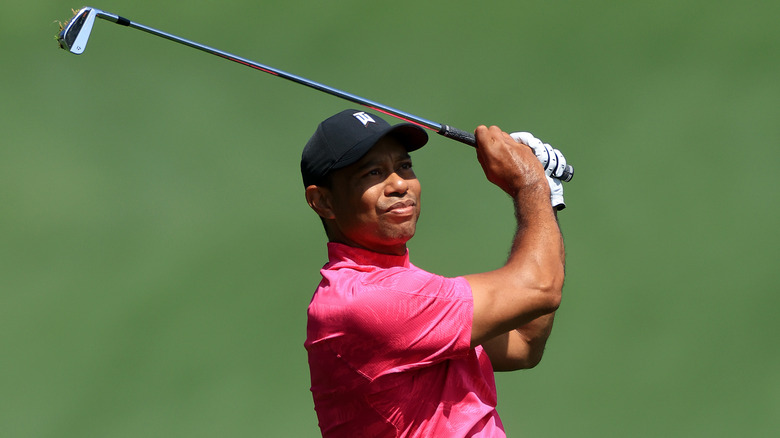 Tiger Woods swings his golf club