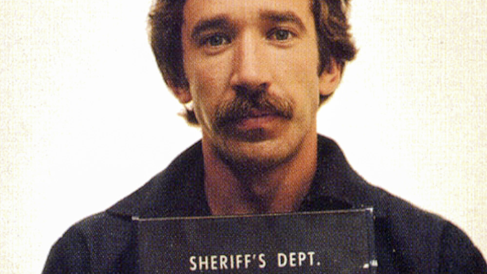 Tim Allen in a mug shot