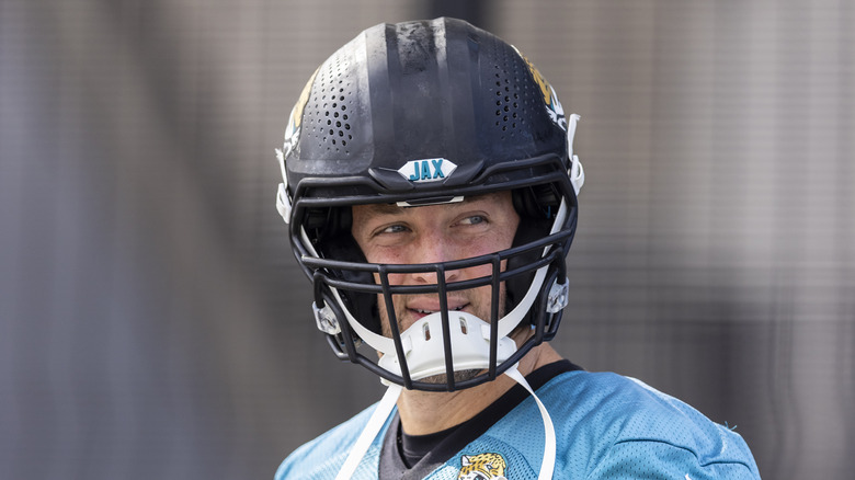 Tim Tebow wears a helmet in football practice