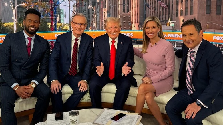 Lawrence Jones, Steve Doocy, Donald Trump, Ainsley Earhardt, and Brian Kilmeade on the set of Fox & Friends (2024)