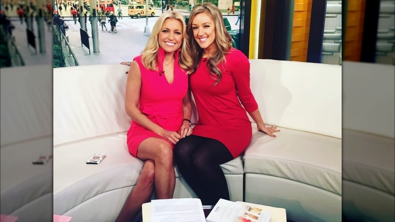 Ainsley Earhardt poses with guest Megan Alexander on the set of Fox & Friends (2022)