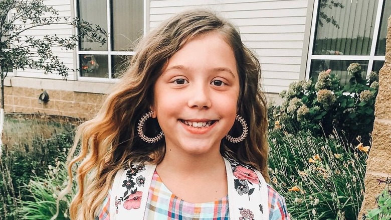 Aubree Lind-DeBoer wearing earrings