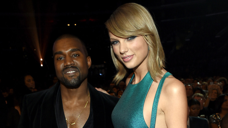 Kanye West posing with Taylor Swift