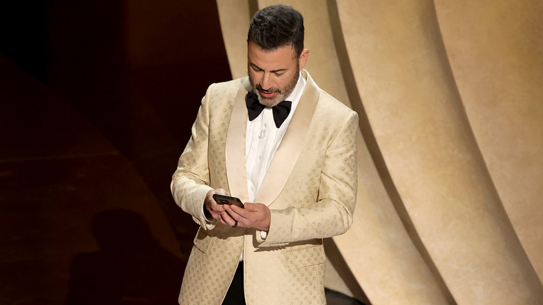 Jimmy Kimmel looking down at his phone