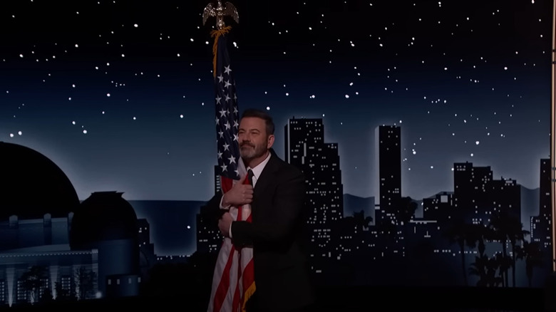 Jimmy Kimmel hugging flag