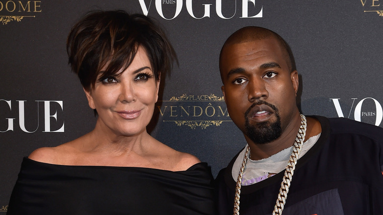 Kris Jenner and Ye West posing together on the red carpet