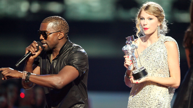 Ye West on stage with Taylor Swift at the VMAs