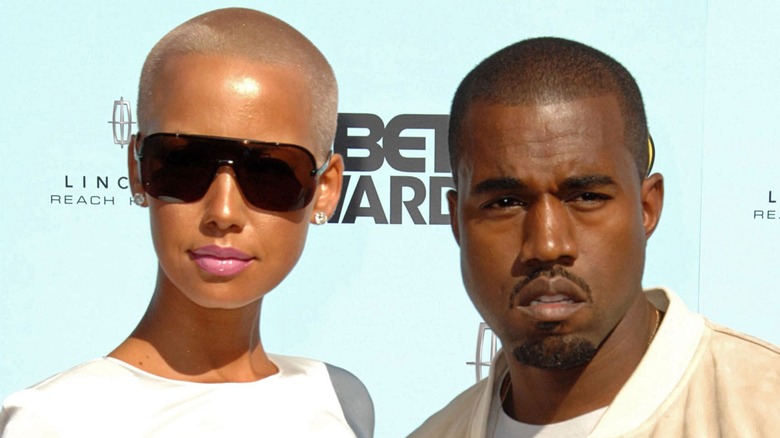 Amber Rose and Ye West posing on the red carpet