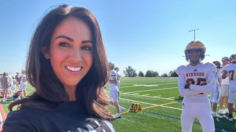 Lauren Boebert on football field with son