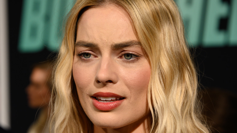 Margot Robbie looking upset at event